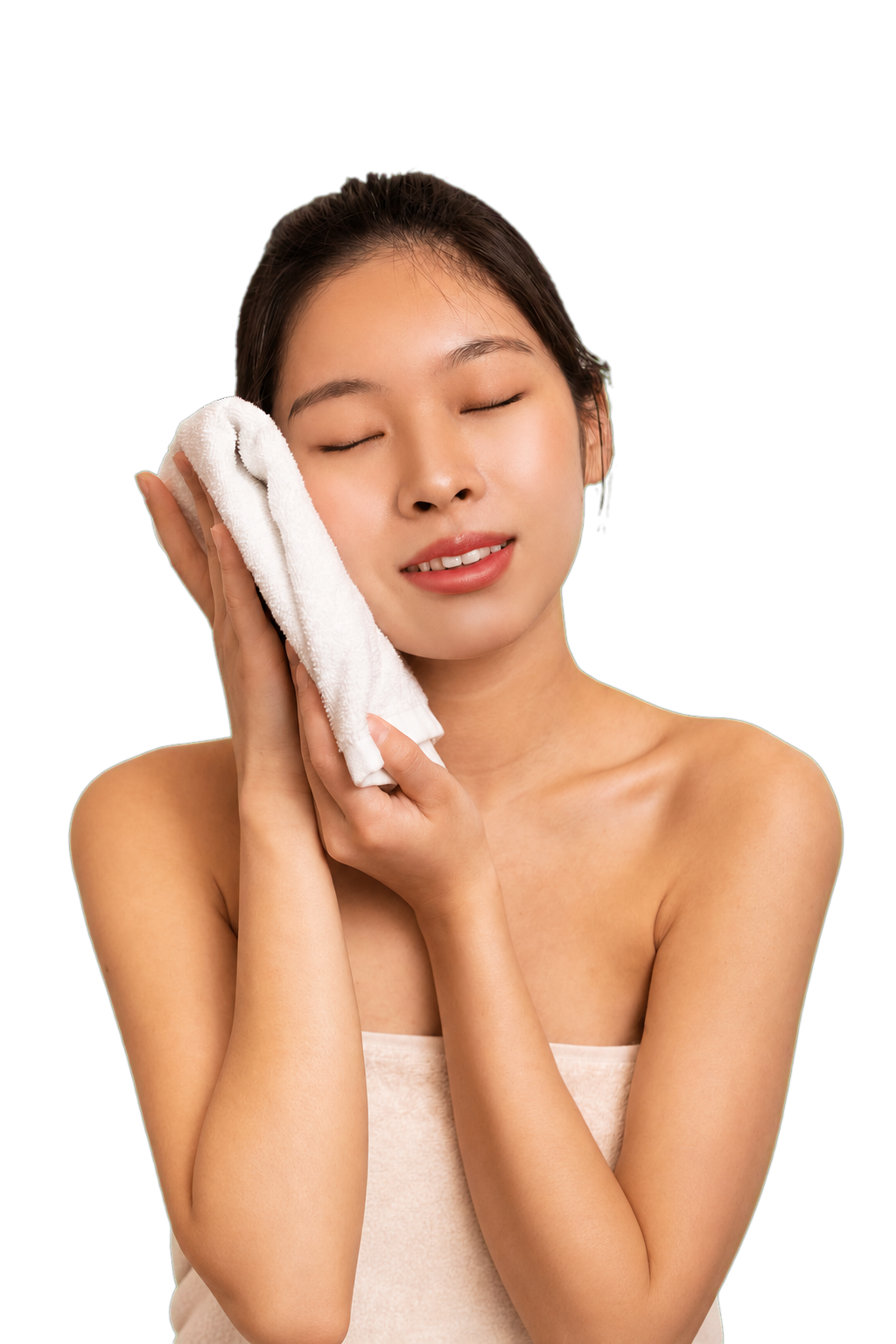 Woman gently pressing a soft white towel against her face